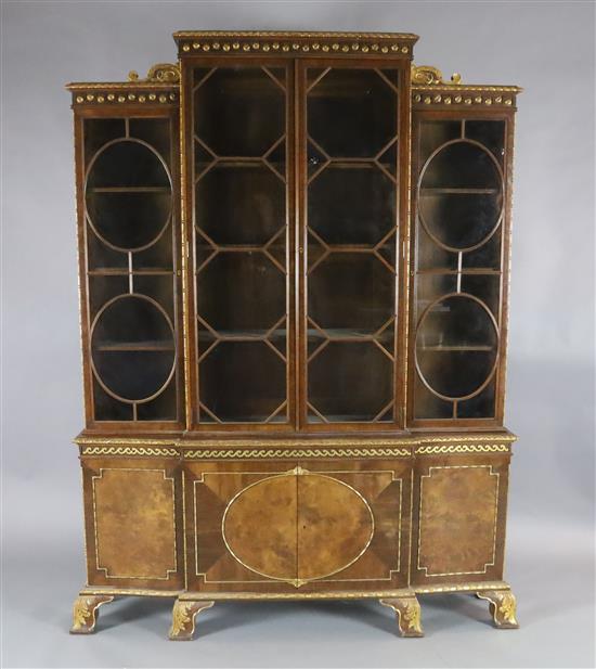 An early 20th century parcel gilt walnut breakfront bookcase, W.5ft 2in. D.1ft 2.5in. H.6ft 8in.